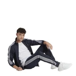 Adidas Sportswear Basic 3-Streifen Tricot Trainingsanzug 10680741 -Kleiderliebe Laden HZ2220 7 APPAREL On Model Walking View transparent