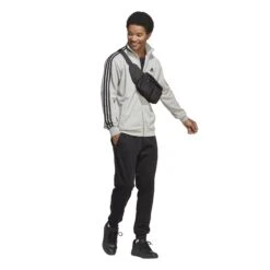 Adidas Sportswear Basic 3-Streifen French Terry Trainingsanzug 10680739 -Kleiderliebe Laden IC6748 7 APPAREL On Model Walking View transparent