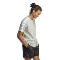 Adidas Essentials Single Jersey 3-Streifen T-Shirt 10680831 -Kleiderliebe Laden IC9337 6 APPAREL On Model Walking View transparent